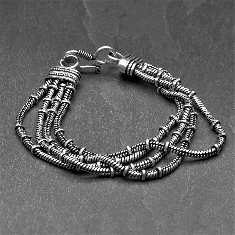 Handmade silver toned plated brass, multi four strand, subtle beaded snake chain bracelet designed by OMishka.