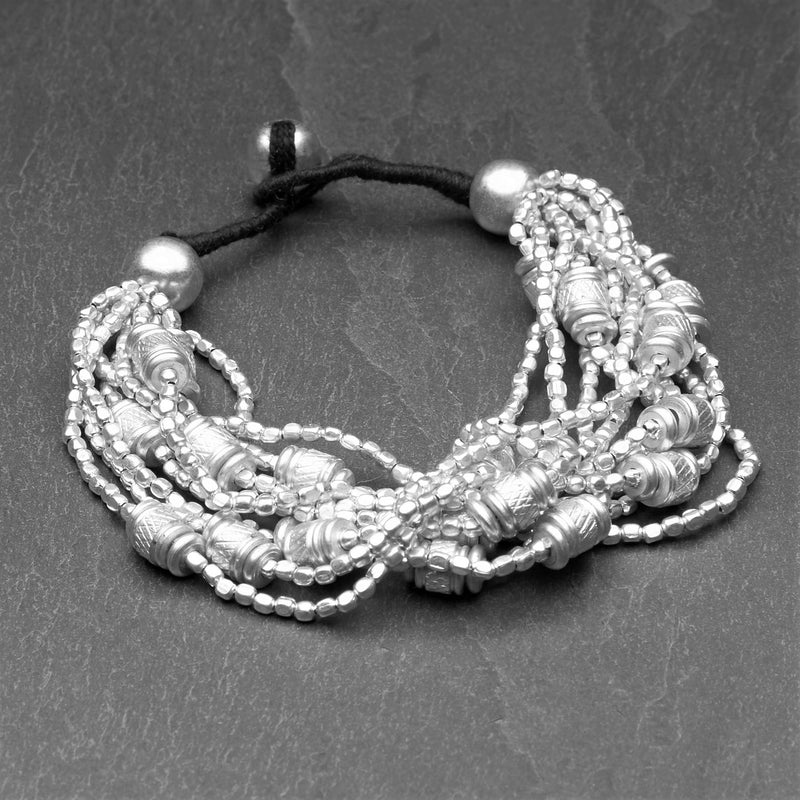 Handmade silver, chunky charm and tiny cube beaded multi strand bracelet designed by OMishka.