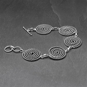 Handmade silver toned brass, five coiled rope spiral detail, adjustable bracelet designed by OMishka.