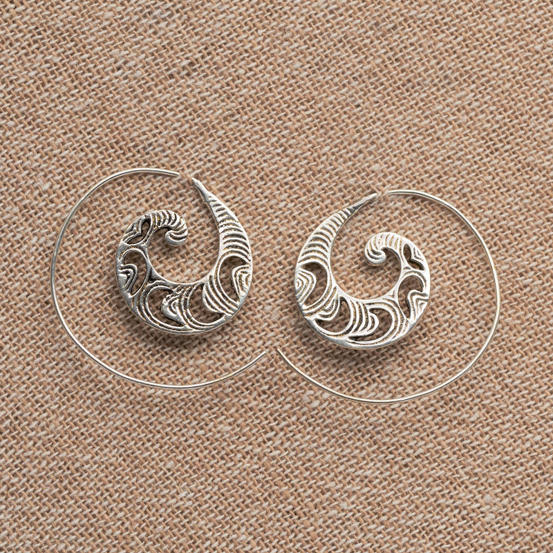 Handmade solid silver, dainty, crescent and swirl patterned spiral hoop earrings designed by OMishka.