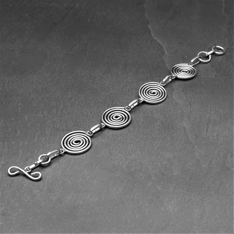 Handmade silver toned brass, 4 simple infinity spirals, chain linked bracelet designed by OMishka.