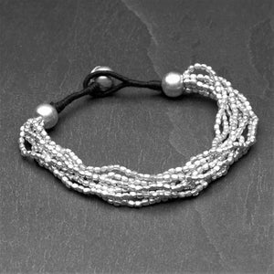 Handmade silver toned, simple tiny cube beaded multi strand bracelet designed by OMishka.