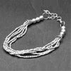 Handmade simple silver beaded multi strand, adjustable bracelet designed by OMishka.