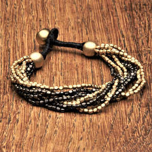 Handmade two tone golden and black brass, tiny cube beaded multi strand bracelet designed by OMishka.