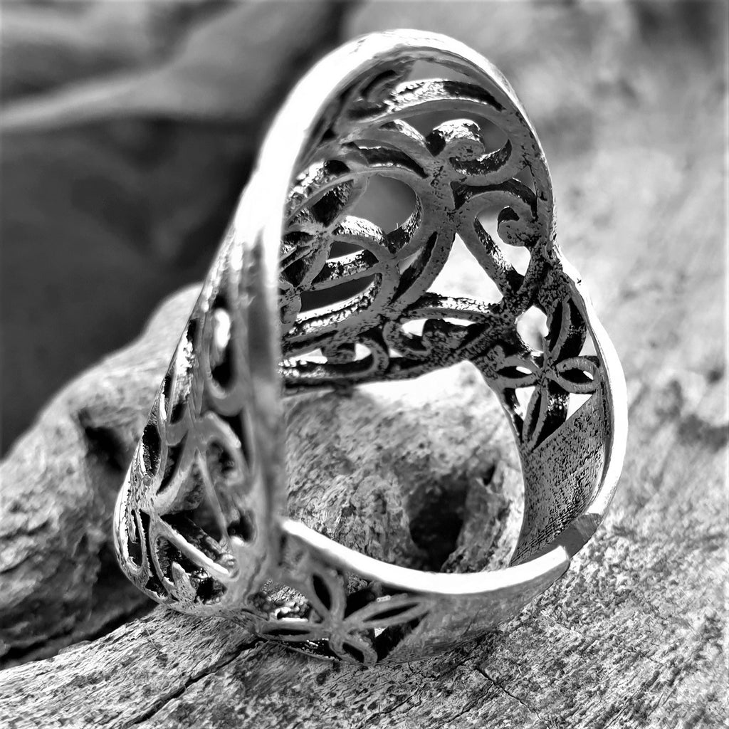 A large, adjustable, nickel free solid silver, decorative seed of life ring designed by OMishka.