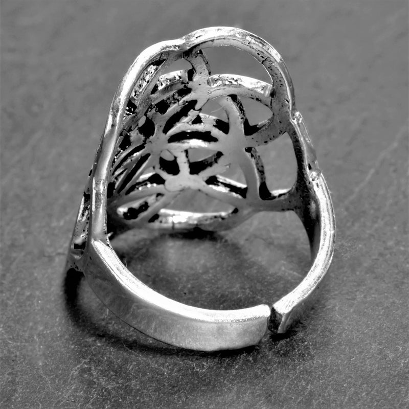 A large, handmade, adjustable solid silver seed of life ring designed by OMishka.