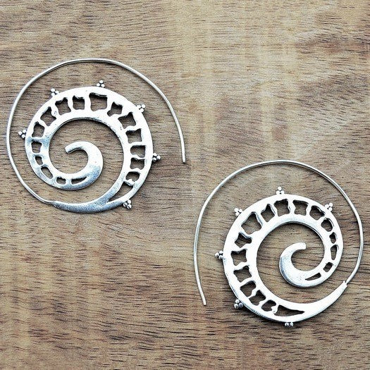 Large, nickel free solid silver, spiral hoop earrings with a cut out detail, designed by OMishka.