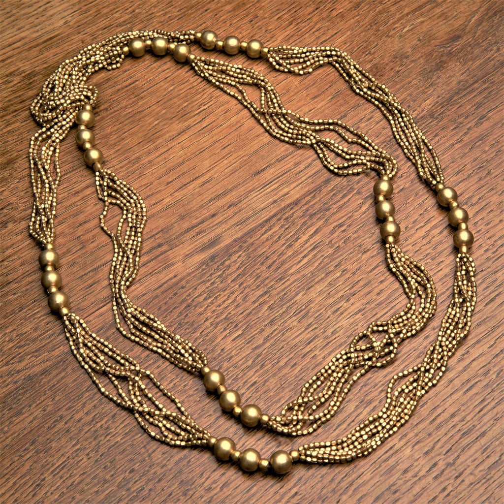 Handmade, chunky, pure brass, long beaded multi strand necklace designed by OMishka.