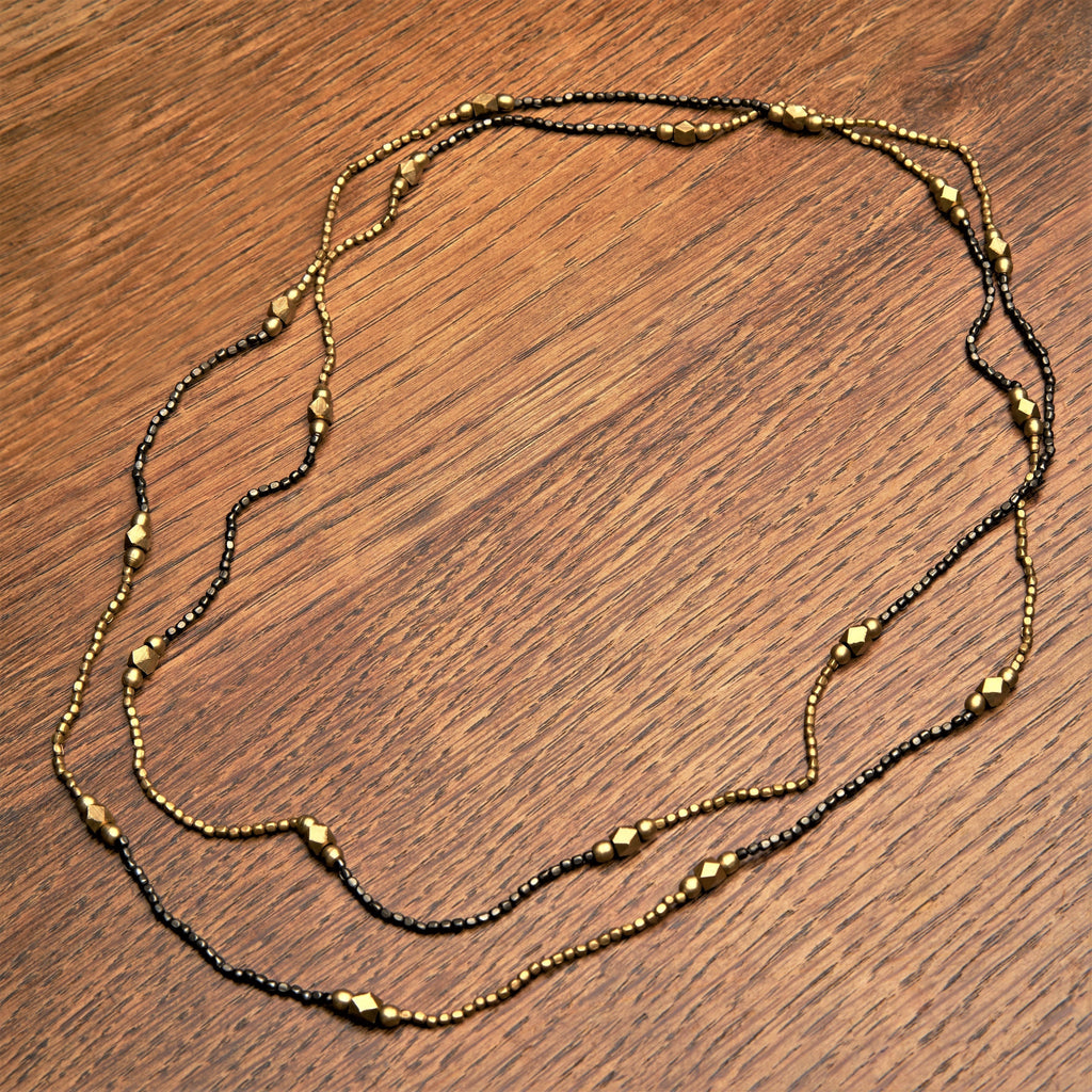 Striped pure golden and black brass beaded, long single strand necklace designed by OMishka.