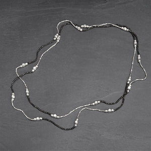 Long, handmade, striped two tone, silver and black beaded, single strand necklace designed by OMishka.