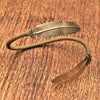 A nickel free pure brass, feather wrap bracelet designed by OMishka.