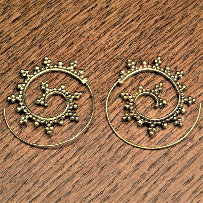 Handmade nickel free pure brass, large, decorative dotted spiral hoop earrings designed by OMishka.