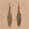 Handmade nickel free pure brass, long feather detailed, drop hook earrings designed by OMishka.