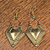 Handmade nickel free pure brass, long, hollow tribal shield, dangle hook earrings designed by OMishka.