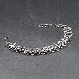 Adjustable, nickel free silver toned brass, decorative beaded infinity link chainmail bracelet designed by OMishka.