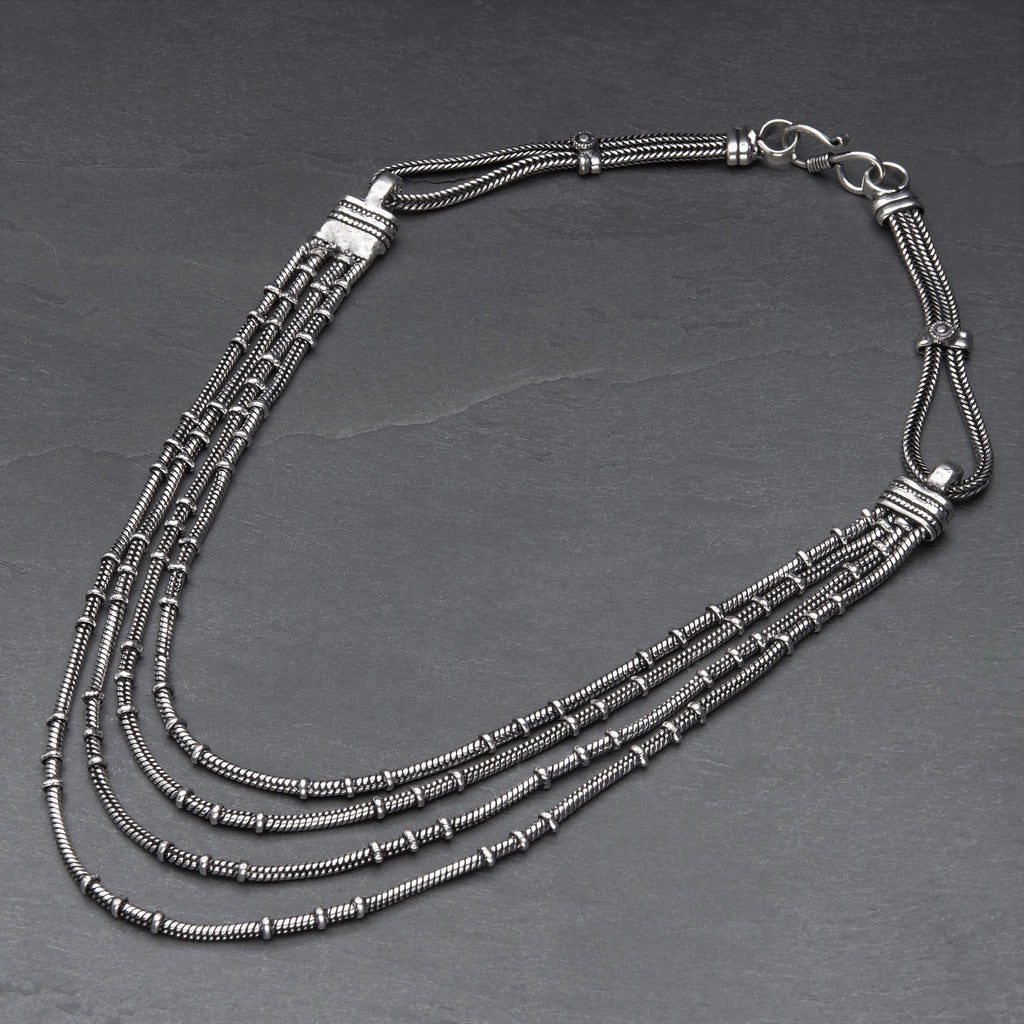 Handmade and nickel free, silver toned white metal, multi strand, subtle disc beaded, layered snake chain necklace designed by OMishka.