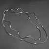 Handmade and nickel free, silver toned and black brass, striped beaded, long single strand necklace designed by OMishka.