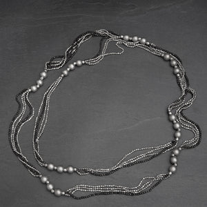 Handmade and nickel free, striped silver toned and black brass, beaded, long multi strand necklace designed by OMishka.