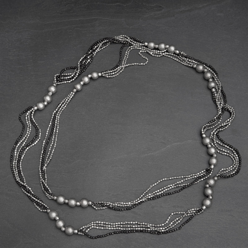 Handmade and nickel free, striped silver toned and black brass, beaded, long multi strand necklace designed by OMishka.