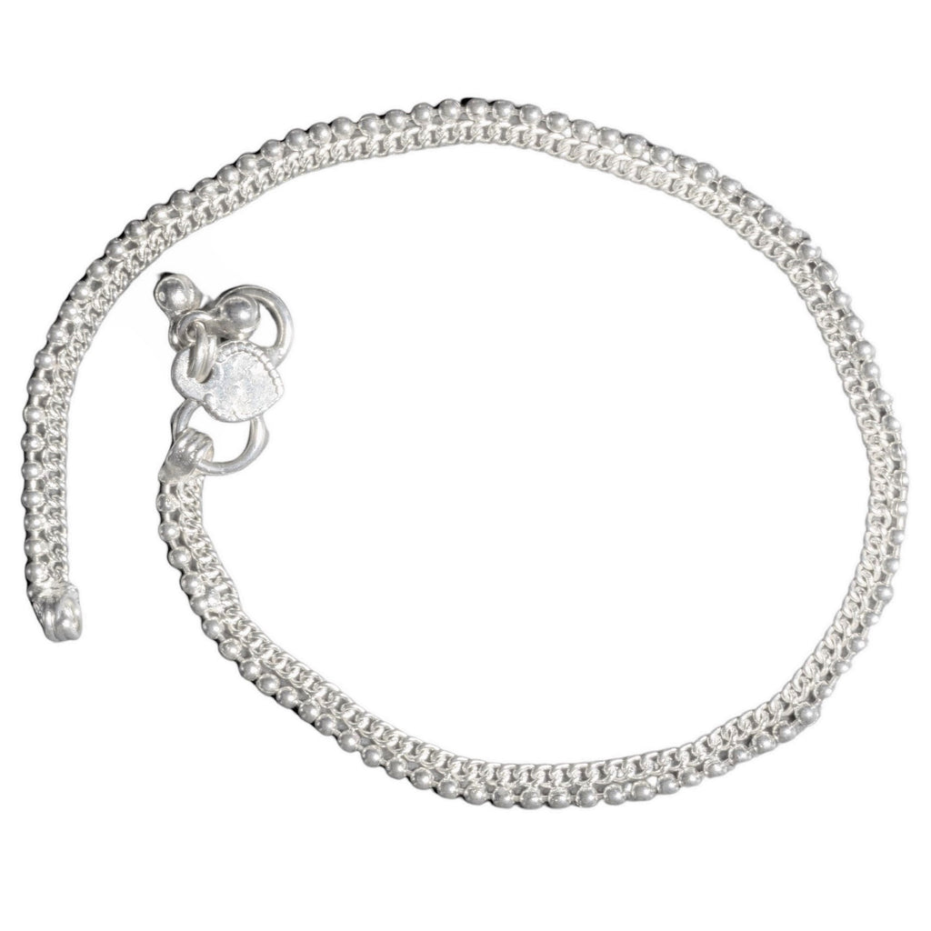 A pretty, nickel free solid silver dainty beaded anklet with tiny bells designed by OMishka.