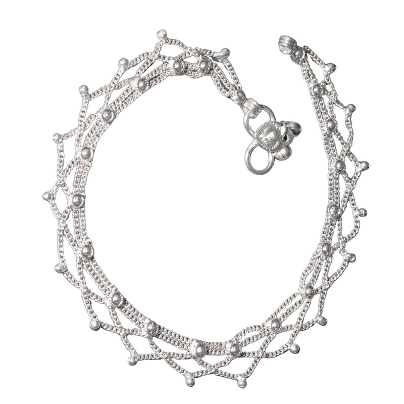 A nickel free solid silver, fancy drop chain  anklet with tiny bells designed by OMishka.