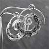 Handmade nickel free solid silver, feather detailed, spiral hoop earrings designed by OMishka.