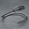 A nickel free silver, feather wrap torque bracelet designed by OMishka.