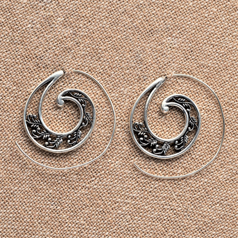 Handmade nickel free solid silver, floral cut out detailed, spiral hoop earrings designed by OMishka.