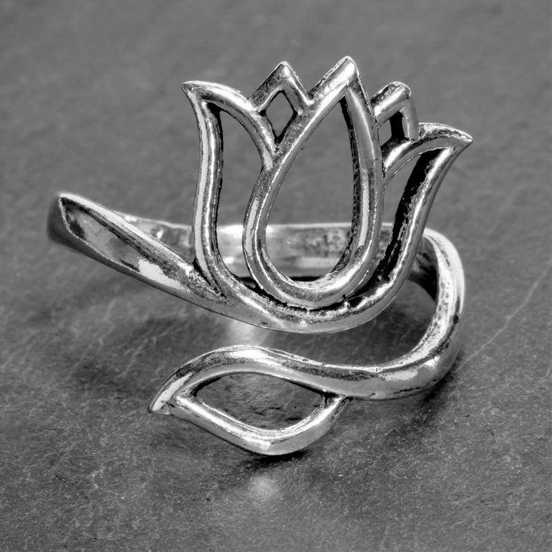 An adjustable, nickel free solid silver, open lotus flower wrap ring designed by OMishka.