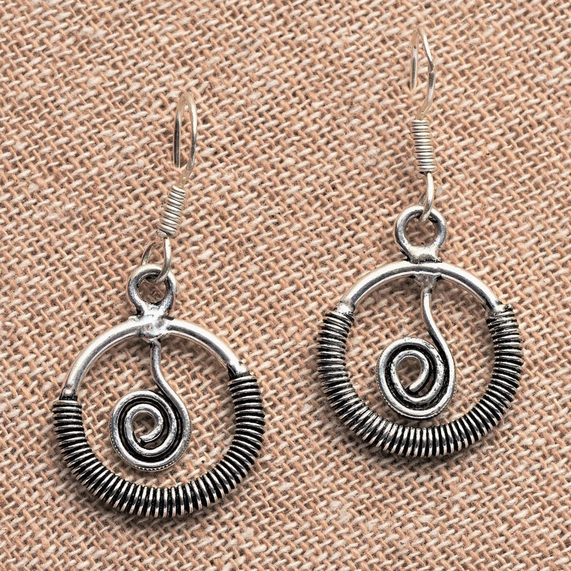 Handmade, nickel free solid silver, open circle and spiral detail, drop hook earrings designed by OMishka.