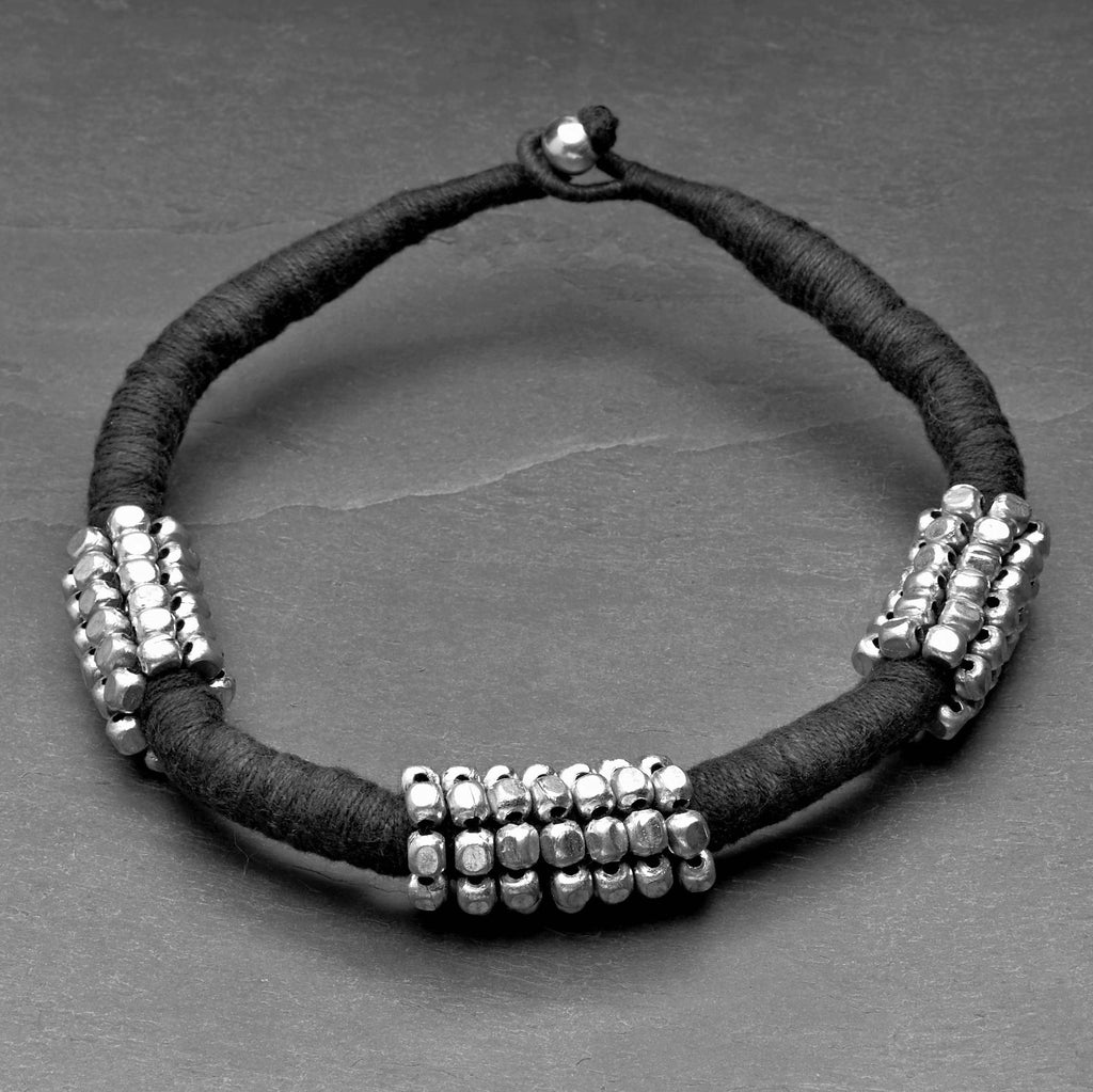 Handmade and nickel free, chunky silver beaded, black woven hemp cord, choker necklace designed by OMishka.