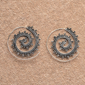 Handmade nickel free solid silver, tribal dotted patterned spiral hoop earrings designed by OMishka.
