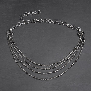 Silver toned white metal, layered four strand, subtle beaded, adjustable snake chain choker necklace designed by OMishka.