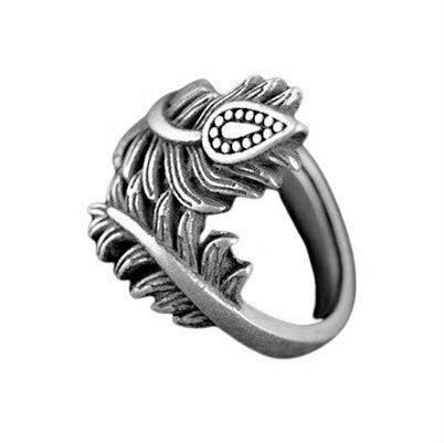 An adjustable, dainty, solid silver peacock feather wrap ring designed by OMIshka.
