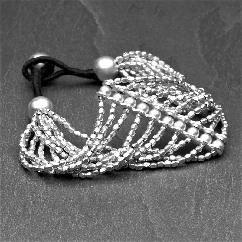 Handmade solid silver striped multi strand, elegantly beaded bracelet designed by OMishka.