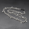 Handmade silver, tiny cube and bone beaded, mini tribal disc, long multi strand necklace designed by OMishka.