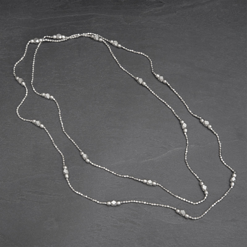 Handmade, silver toned brass, simple single strand, long beaded necklace designed by OMishka.