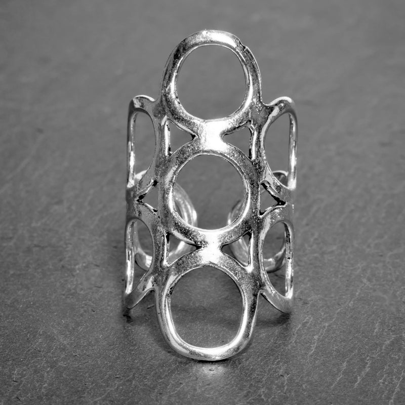 A long, adjustable, smooth textured solid silver, open circle wrap ring designed by OMishka.