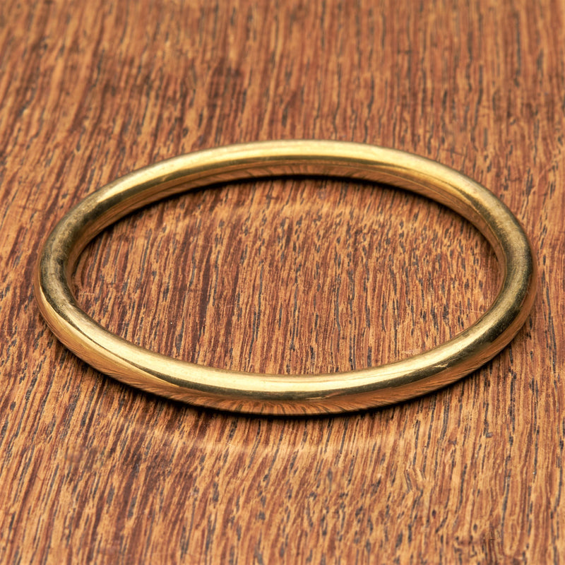 A solid, smooth finished pure brass thin bangle bracelet designed by OMishka.
