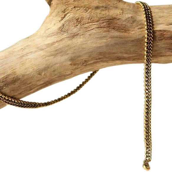 A thin, pure brass beaded ankle bracelet designed by OMishka.
