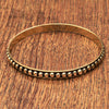 A dainty, dot beaded pure brass thin, bangle bracelet designed by OMishka.