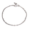 A thin, nickel free solid silver ankle chain with tiny bells designed by OMishka.
