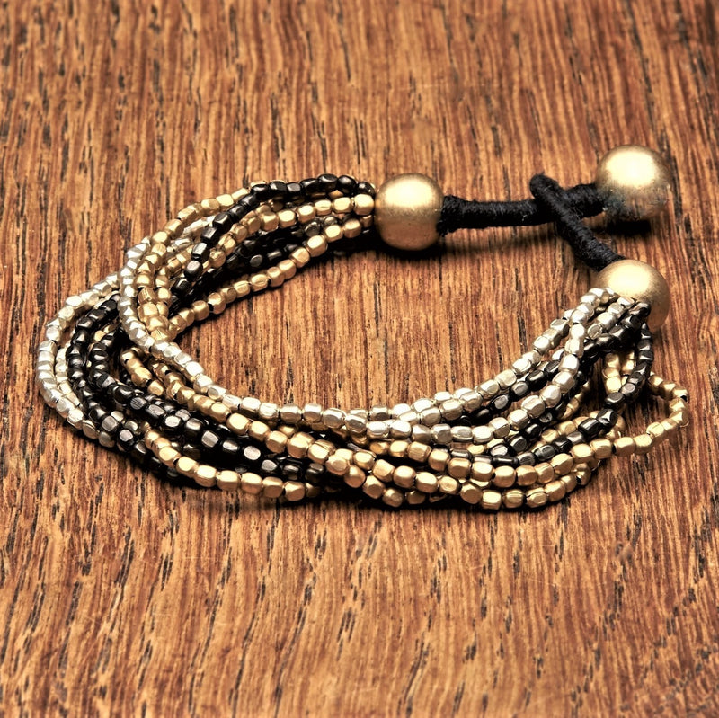 https://omishka.com/cdn/shop/products/OMishka-tri-colour-oxidised-brass-silver-multi-strand-bracelet_800x.jpg?v=1617438047