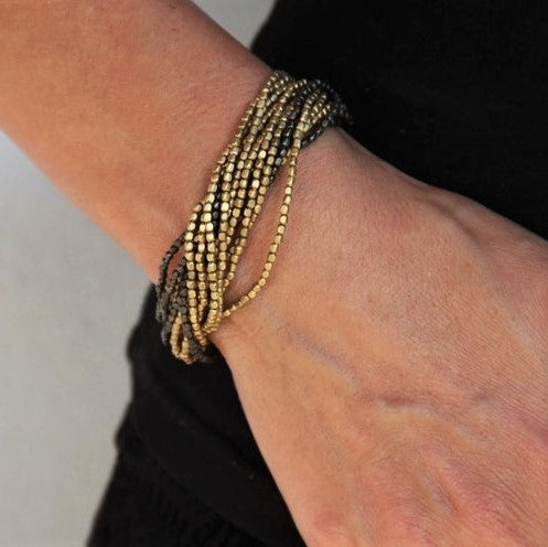 Naga tribe beadwork, two tone golden and black brass, tiny cube beaded multi strand bracelet designed by OMishka.