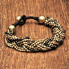 Handmade two tone, golden and oxidised black brass beaded, woven multi strand bracelet designed by OMishka.