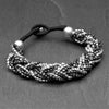 Handmade two tone, silver and oxidised black brass beaded, woven multi strand bracelet designed by OMishka.