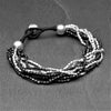 Handmade two tone, oxidised black and silver toned brass, tiny cube beaded multi strand bracelet designed by OMishka.