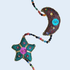 Indian handmade, colourful hanging string of moon and stars, recycled sari fabric and beaded sequins tota decoration.